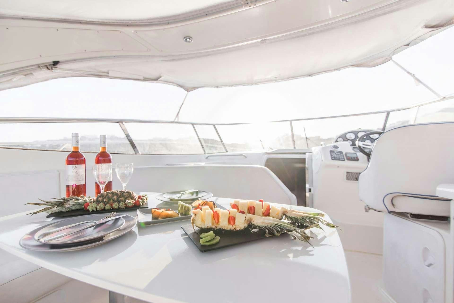 a table with food on it aboard AEGEAN BLUE Yacht for Charter