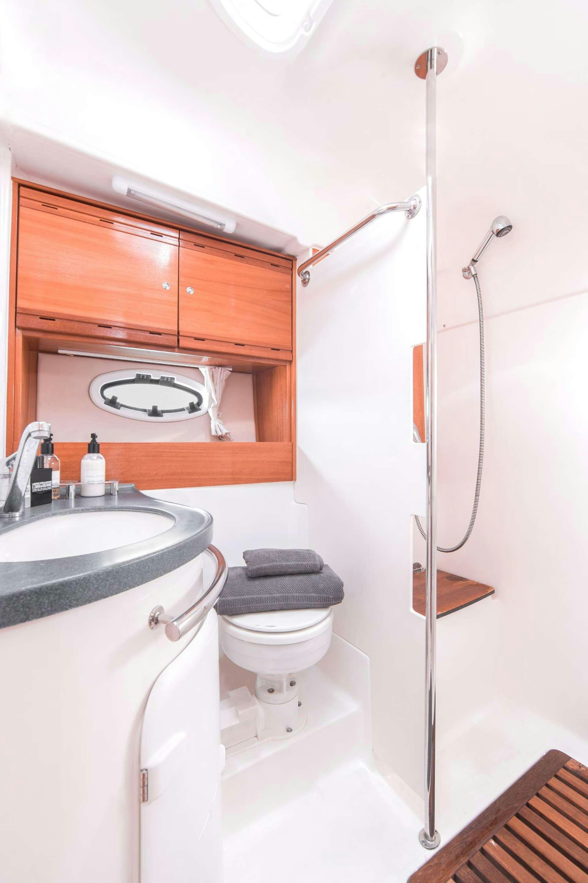a bathroom with a sink and toilet aboard AEGEAN BLUE Yacht for Charter