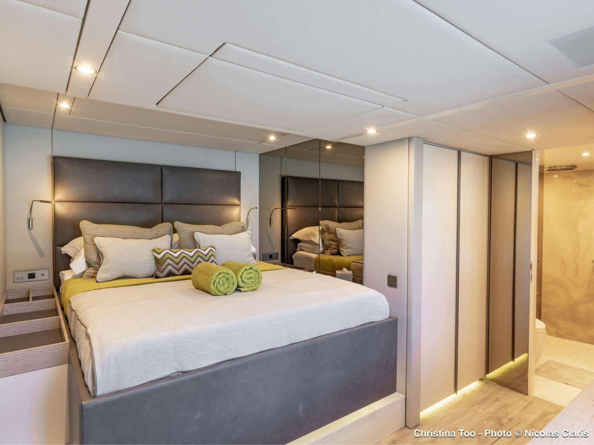 a bed in a room aboard CHRISTINA TOO Yacht for Sale