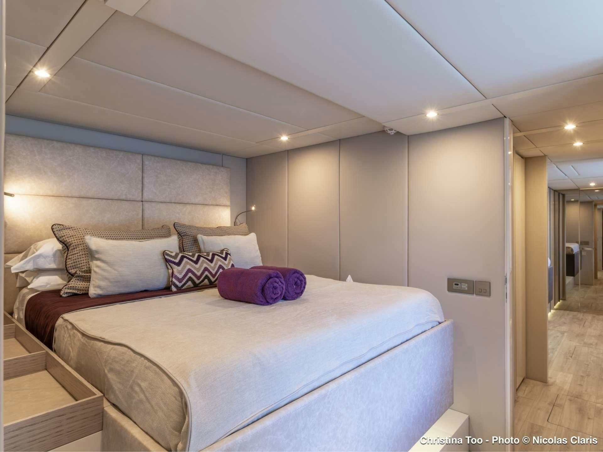 a bed in a room aboard CHRISTINA TOO Yacht for Sale