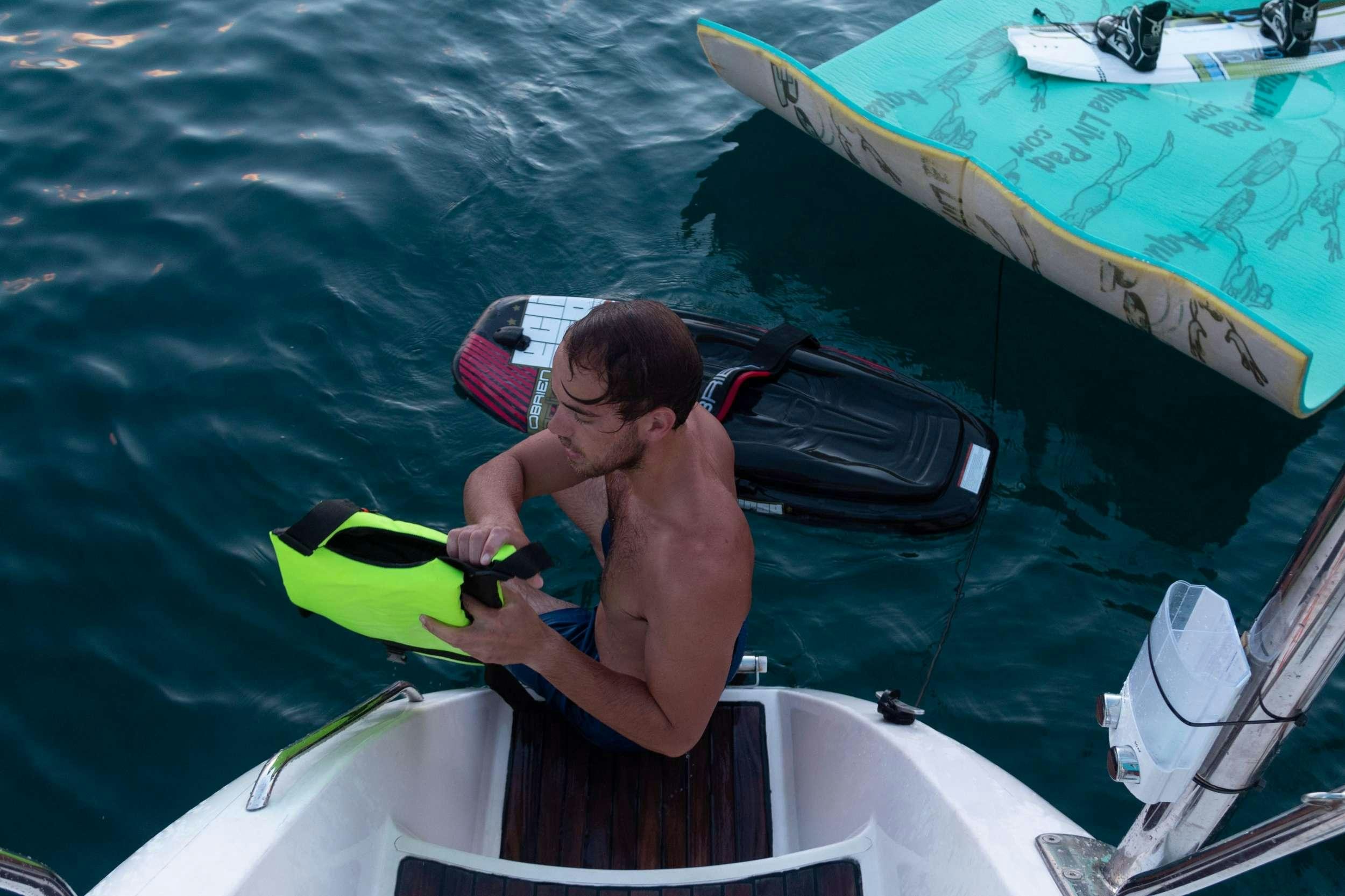 a person in a speedboat aboard NEMO Yacht for Charter