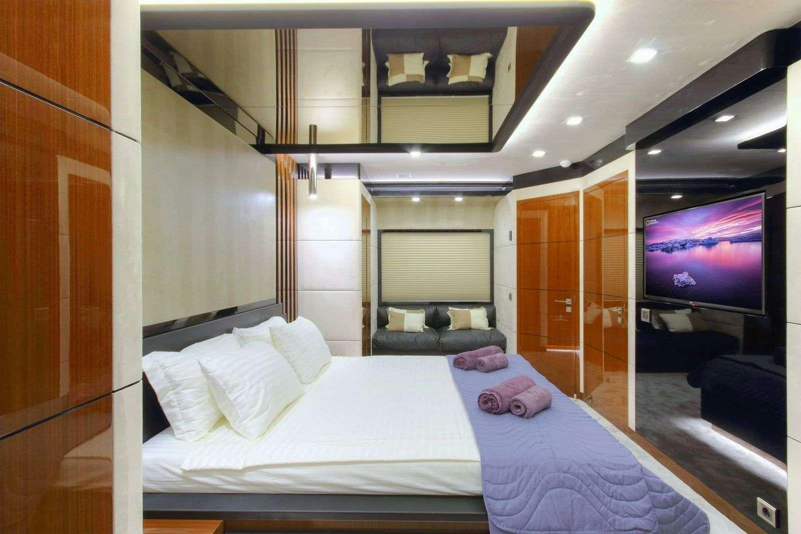 a bed in a room aboard MOSS Yacht for Charter