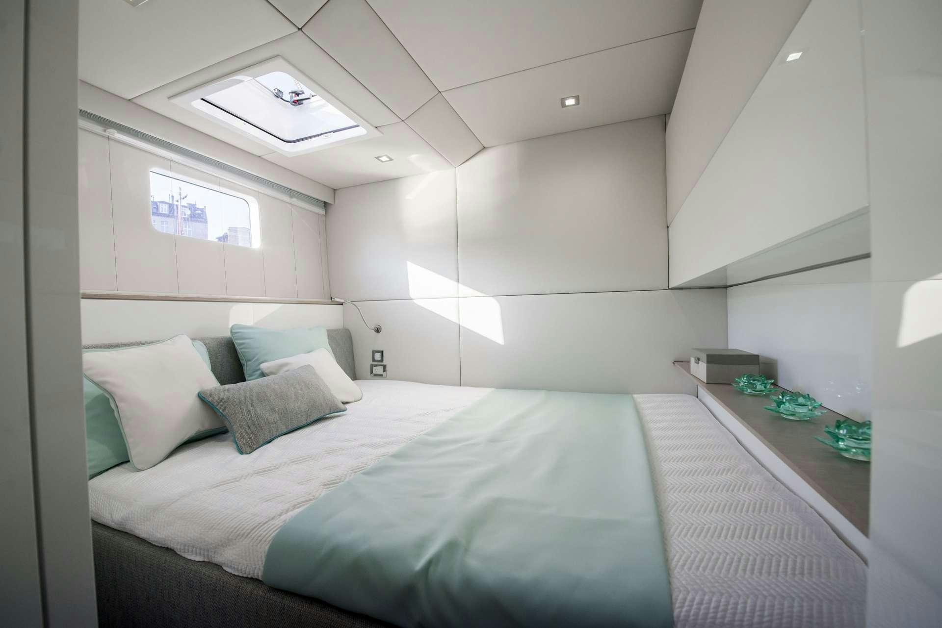 a bed in a room aboard MOONDANCE Yacht for Charter