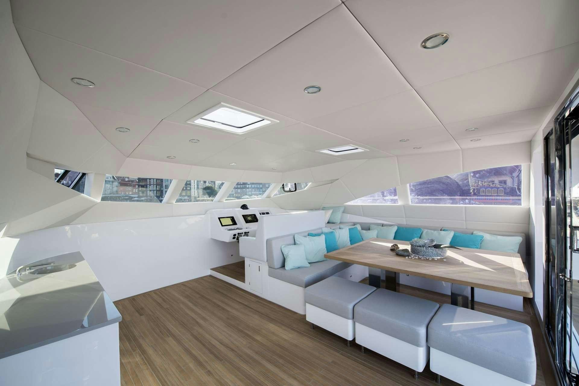 a room with a table and chairs aboard MOONDANCE Yacht for Charter