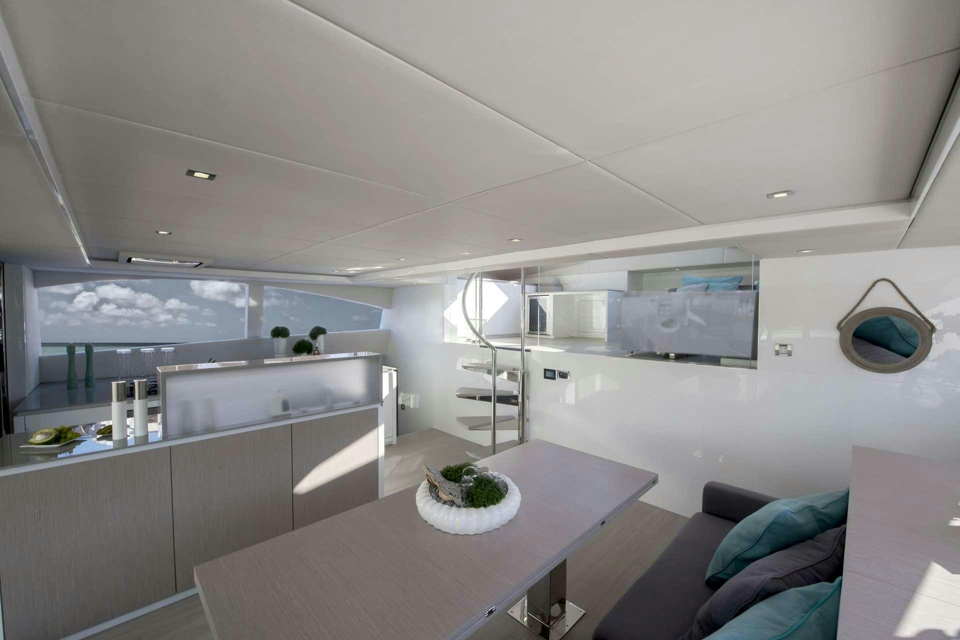a modern kitchen with white cabinets aboard MOONDANCE Yacht for Charter