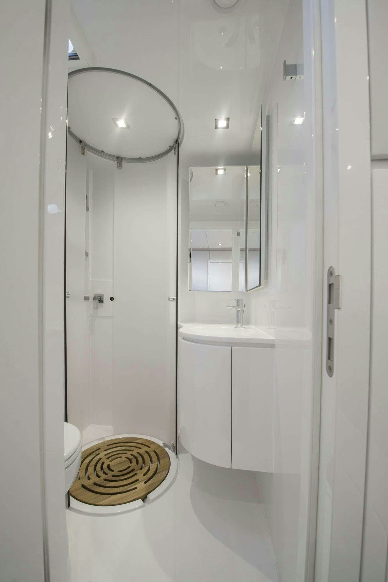 a bathroom with a shower unit aboard MOONDANCE Yacht for Charter