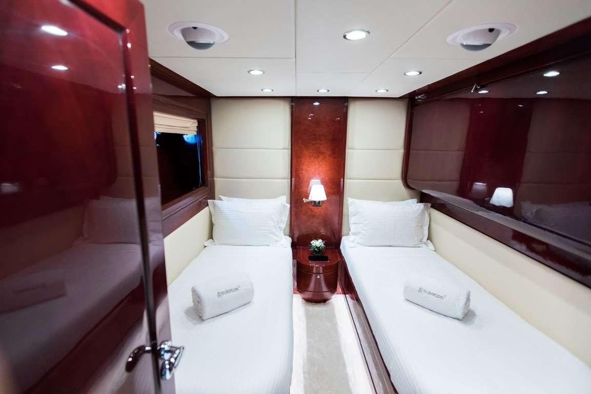 a room with a bed and a mirror aboard ALBATOR 2 Yacht for Charter