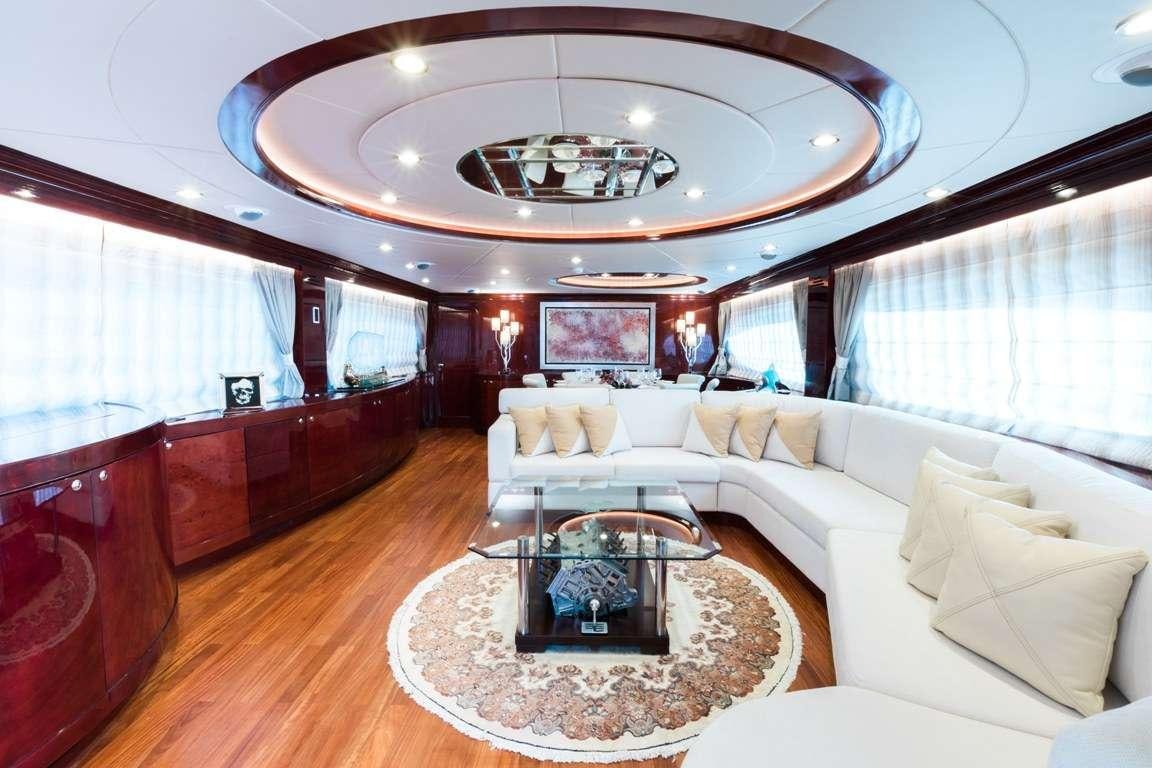 a living room with a large mirror aboard ALBATOR 2 Yacht for Charter