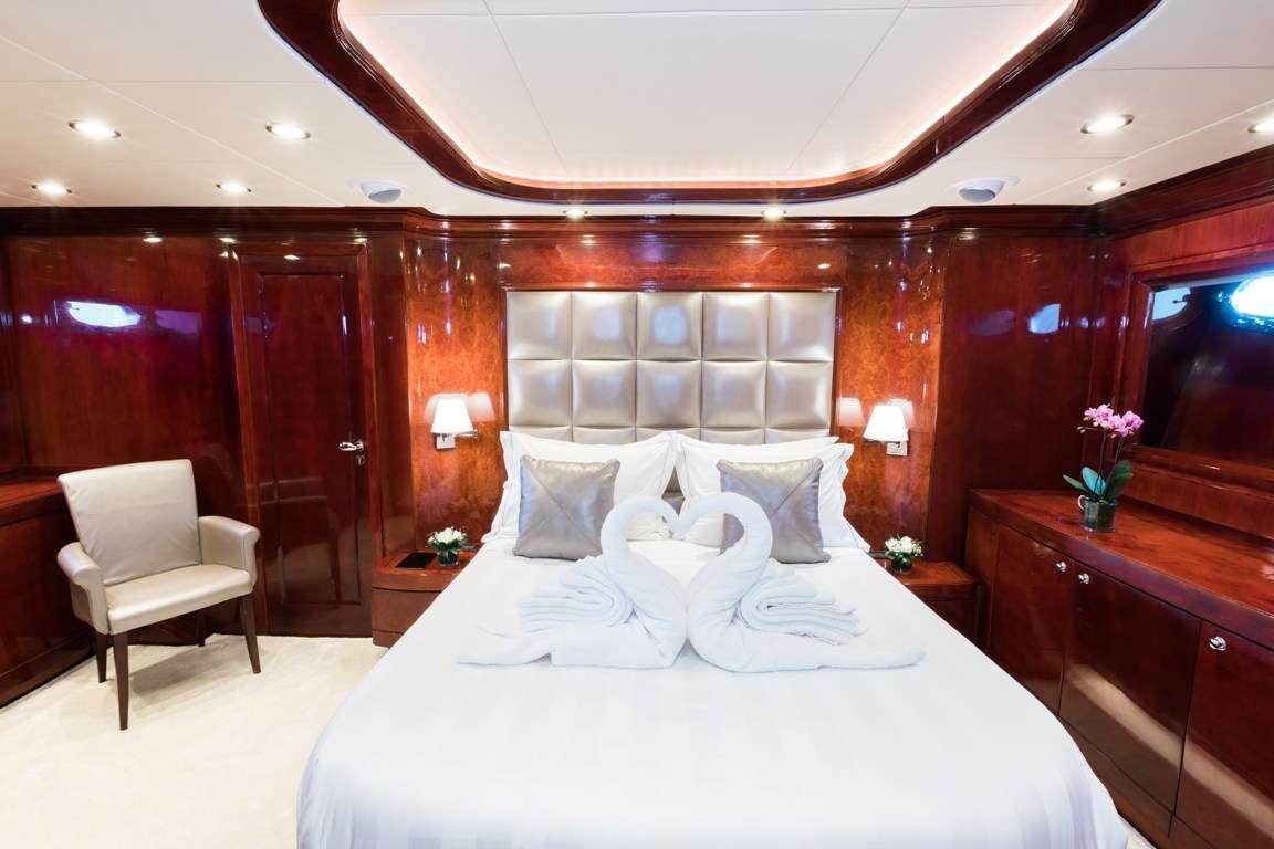 a bed with white sheets aboard ALBATOR 2 Yacht for Charter