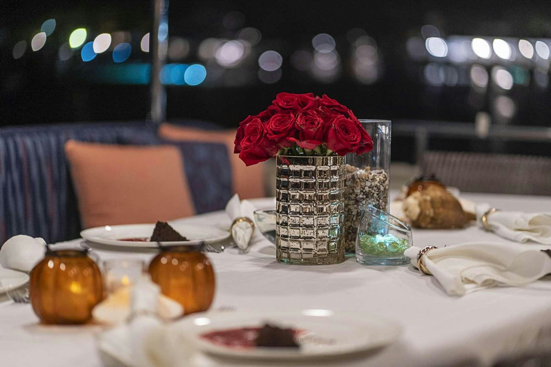 a table with food and glasses on it aboard TRUE NORTH Yacht for Charter