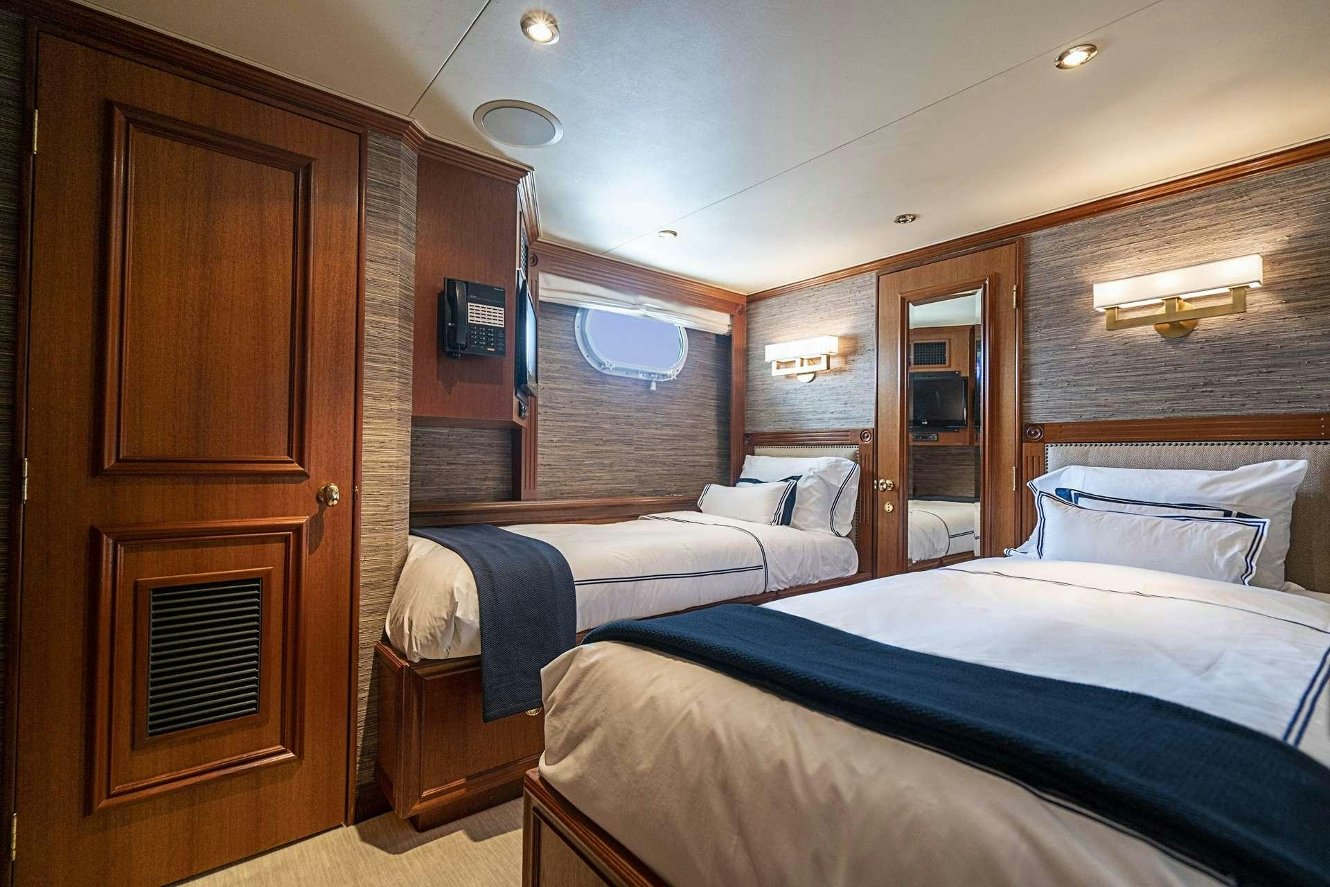 a room with two beds aboard TRUE NORTH Yacht for Charter