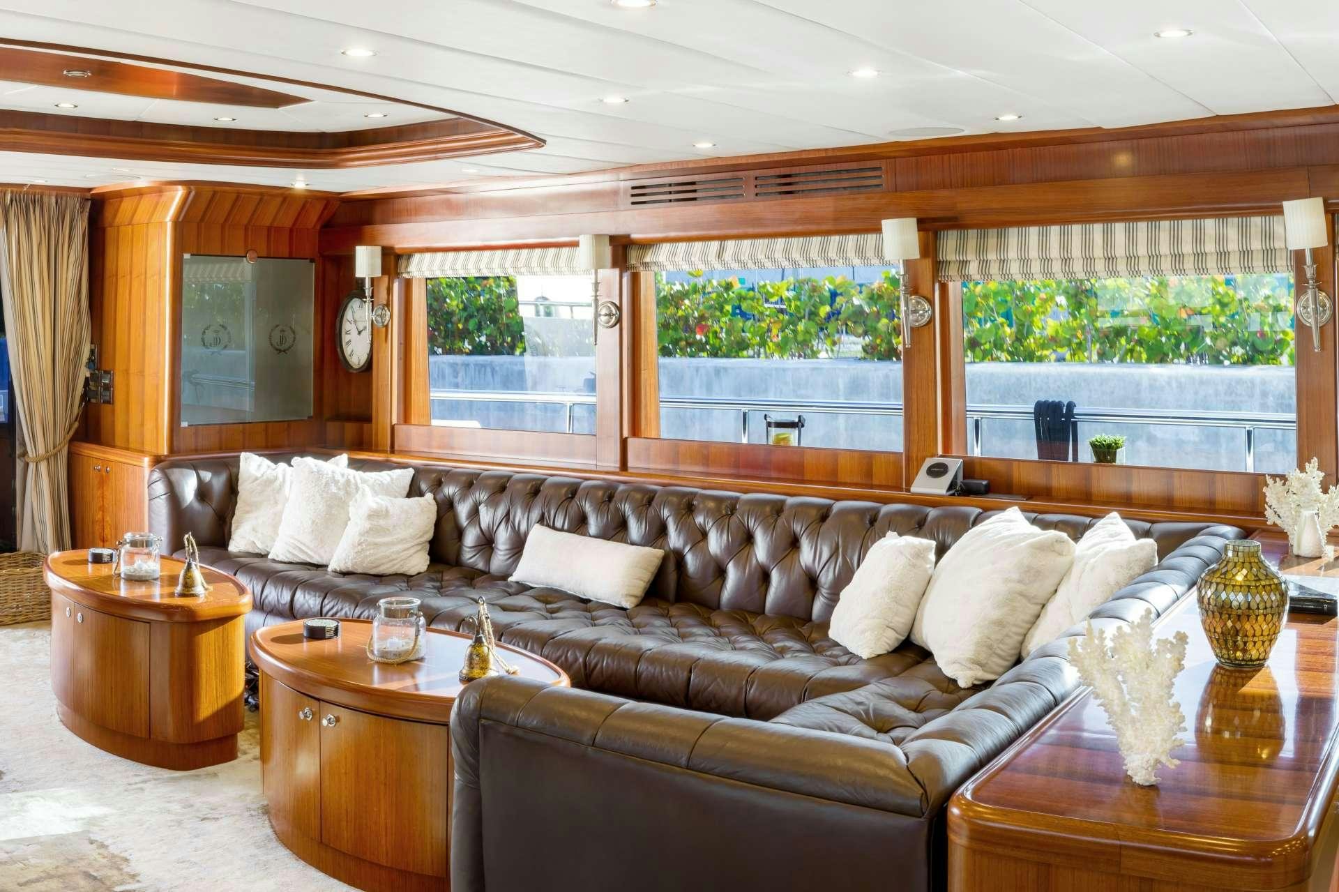 a living room with a leather couch aboard JULIA DOROTHY Yacht for Charter