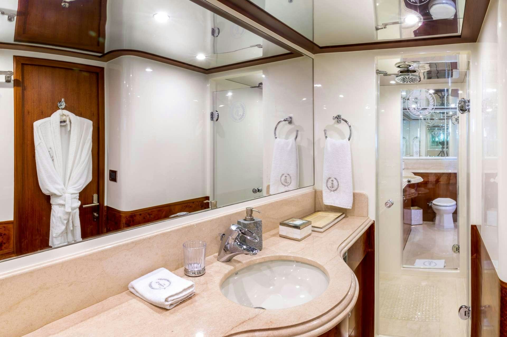 a bathroom with a large mirror aboard JULIA DOROTHY Yacht for Charter