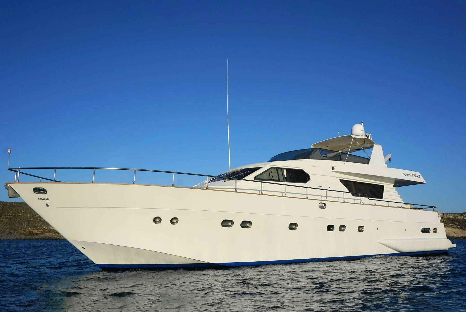a white yacht on the water aboard EMILIA Yacht for Charter