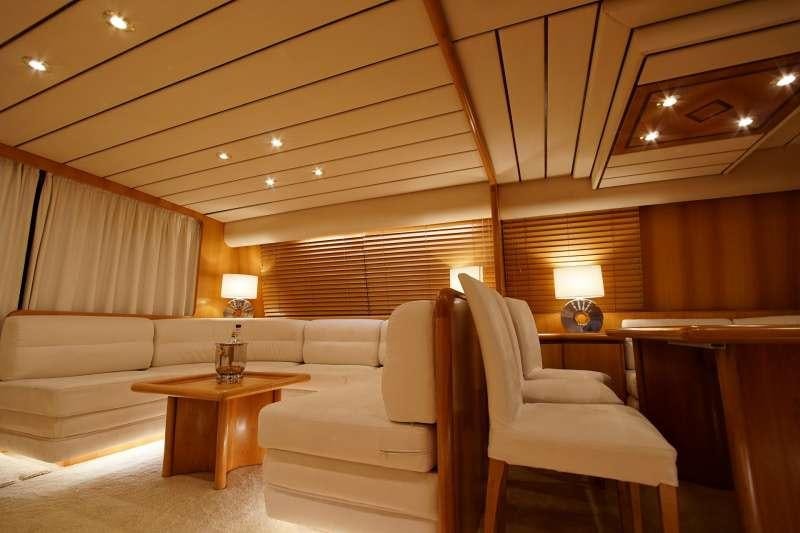 a room with a couch and a table aboard EMILIA Yacht for Charter