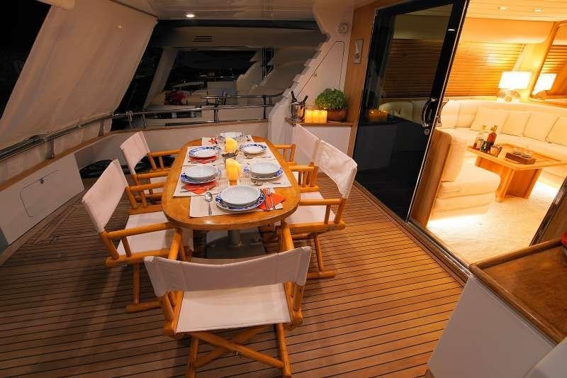 a dining room with a table and chairs aboard EMILIA Yacht for Charter