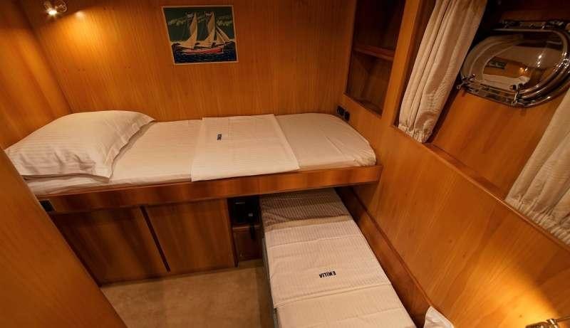 a bed in a room aboard EMILIA Yacht for Charter
