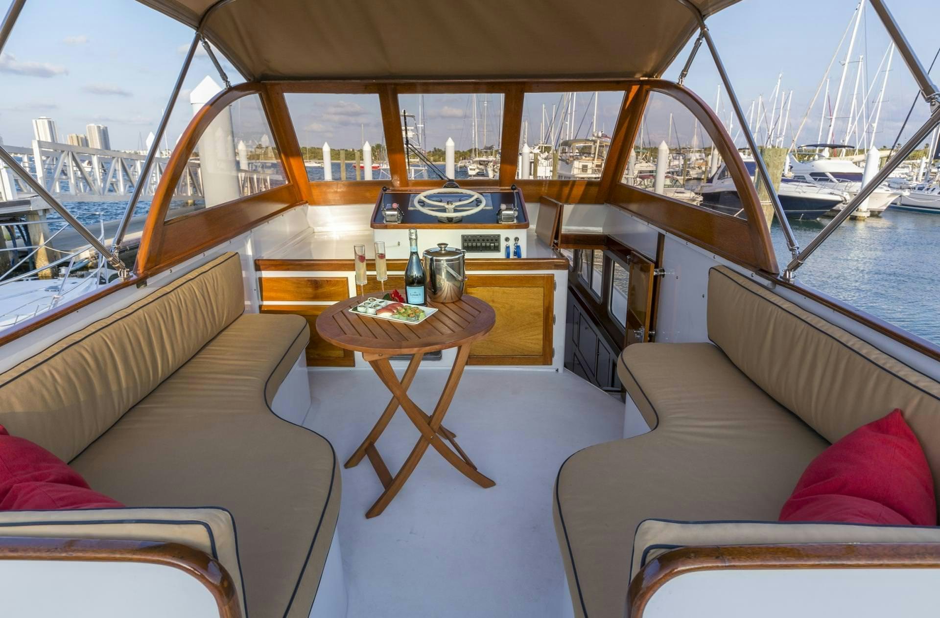 a boat with a table and chairs aboard KINGFISHER Yacht for Charter