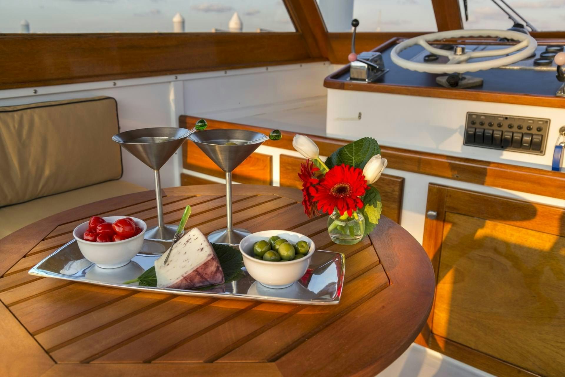 a table with food and drinks aboard KINGFISHER Yacht for Charter