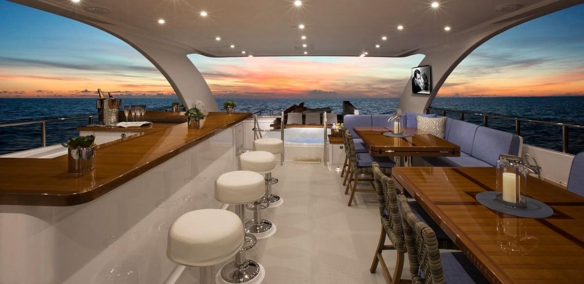 a restaurant with tables and chairs aboard RENAISSANCE Yacht for Charter