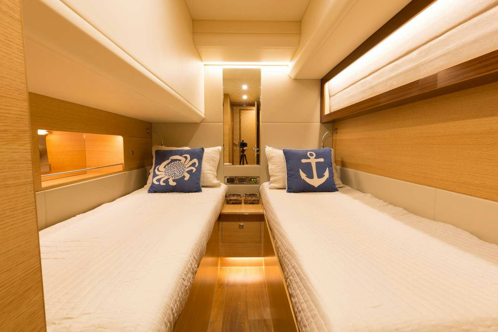 a room with a couple of beds aboard MYSTIC SOUL Yacht for Charter