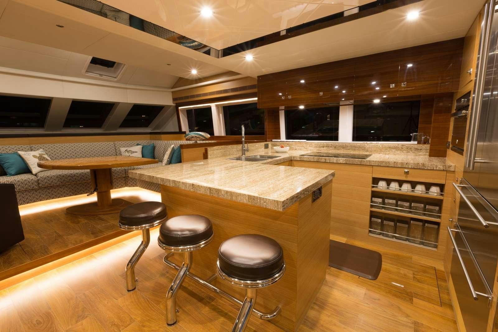 a room with stools and tables aboard MYSTIC SOUL Yacht for Charter