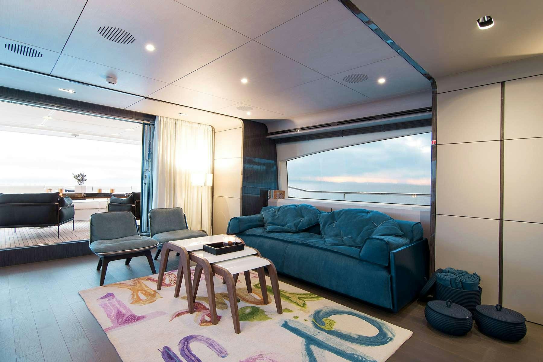 a living room with a couch and a table aboard MEMORIES TOO Yacht for Charter