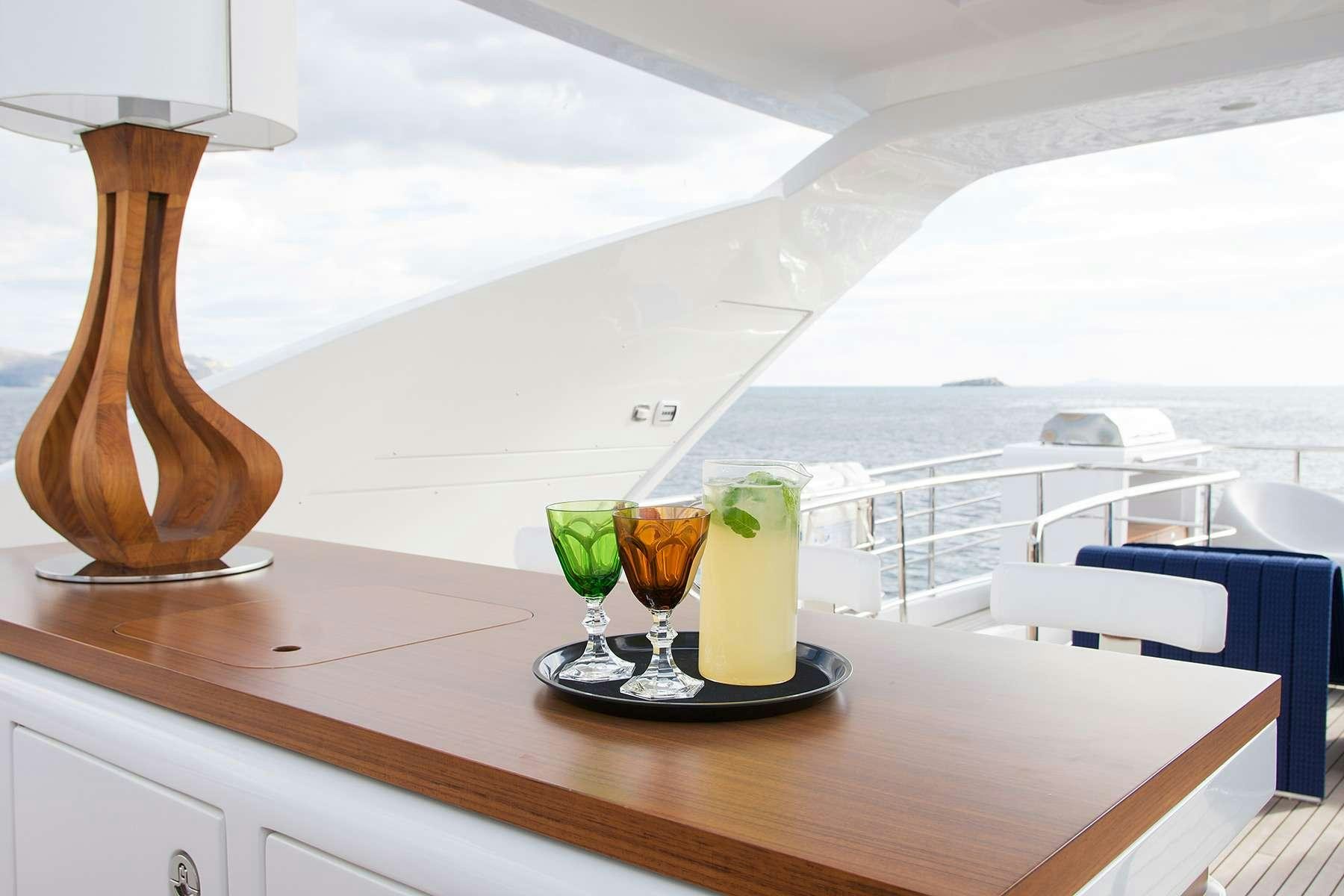 a group of glasses with drinks on a table aboard MEMORIES TOO Yacht for Charter