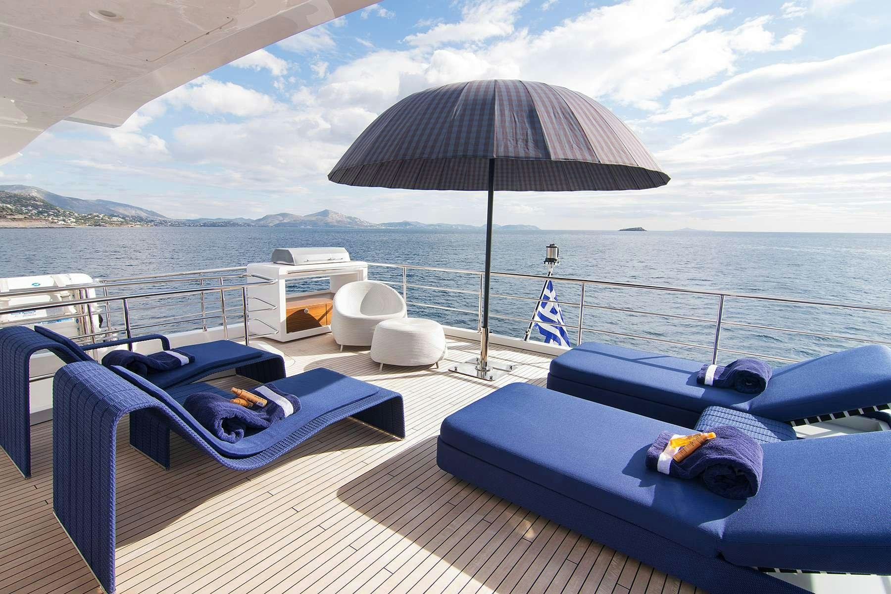 a boat with a umbrella on the deck aboard MEMORIES TOO Yacht for Charter