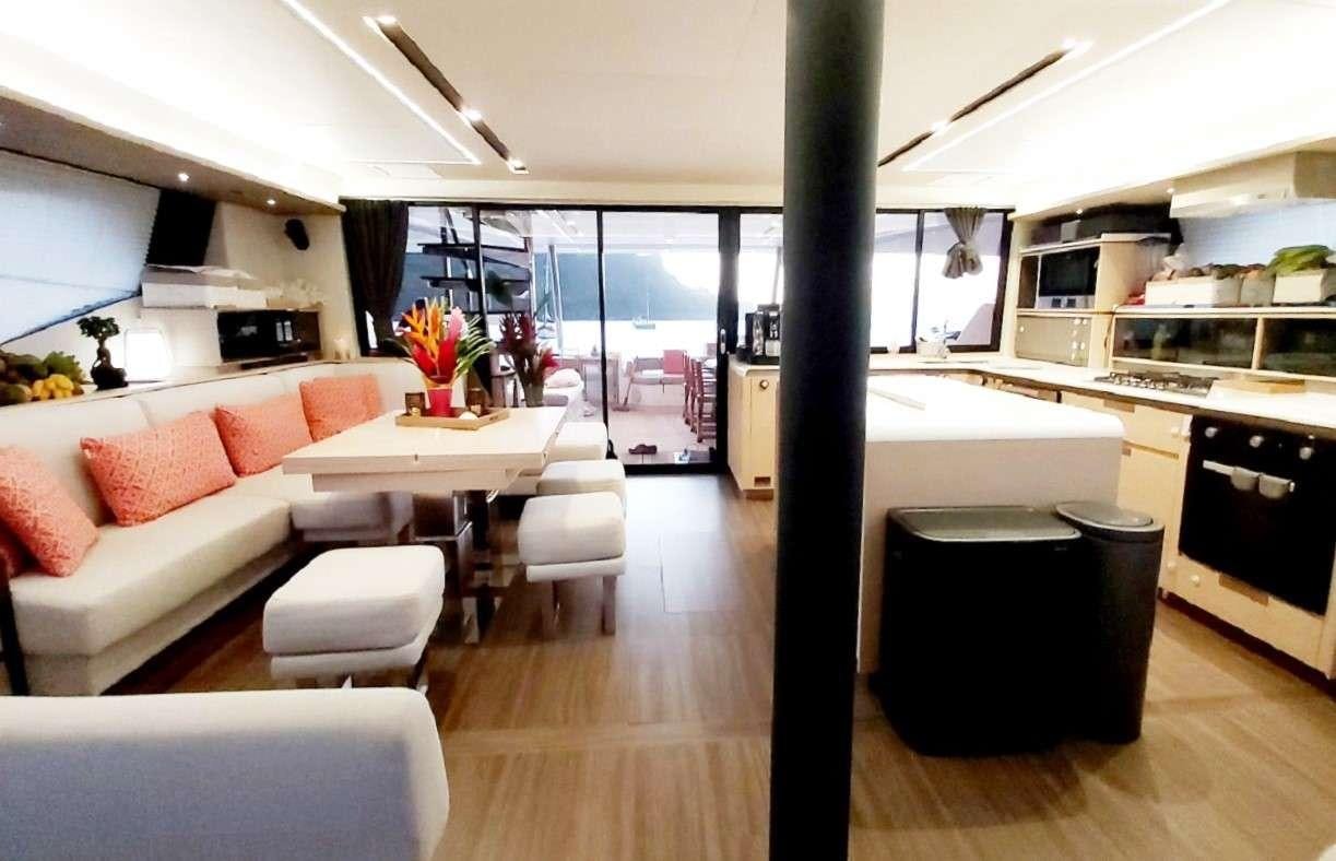 a large kitchen and living room aboard BLACK CAT Yacht for Charter
