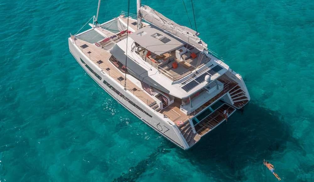 a large ship in the ocean aboard BLACK CAT Yacht for Charter