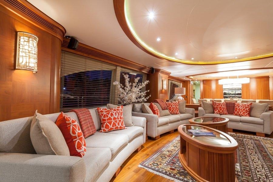 a living room with a couch and a coffee table aboard HAPPY HOUR Yacht for Charter