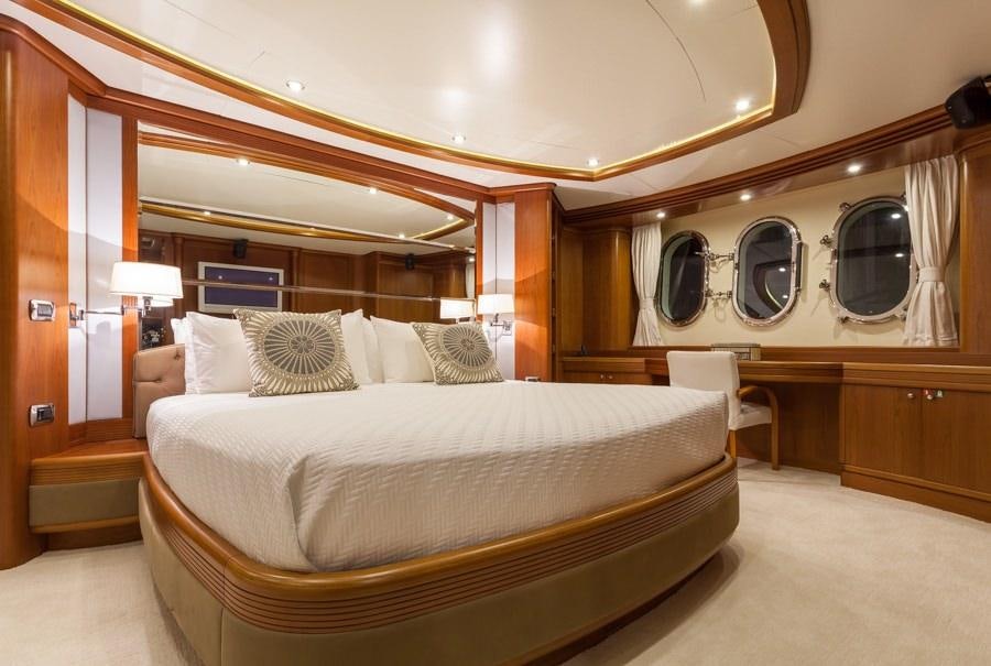 a large bed in a room aboard HAPPY HOUR Yacht for Charter
