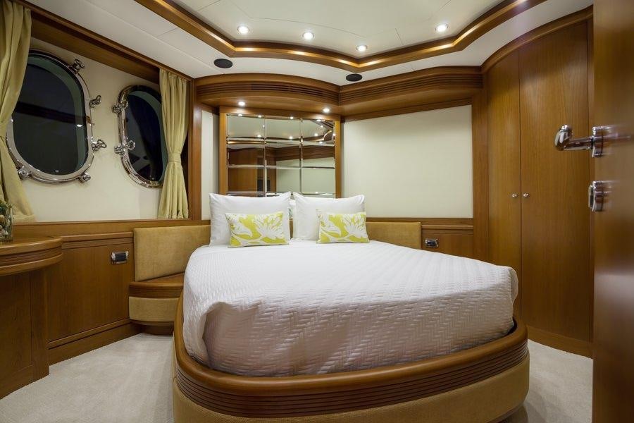 a large bed in a hotel room aboard HAPPY HOUR Yacht for Charter