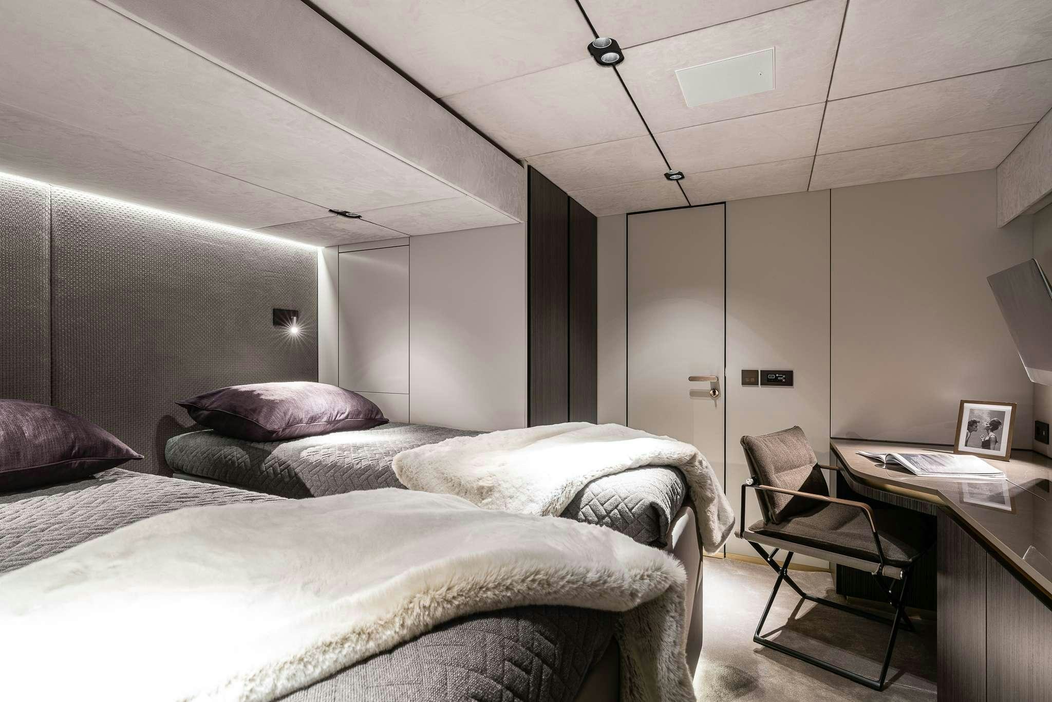 a bedroom with two beds aboard SEIYA Yacht for Charter