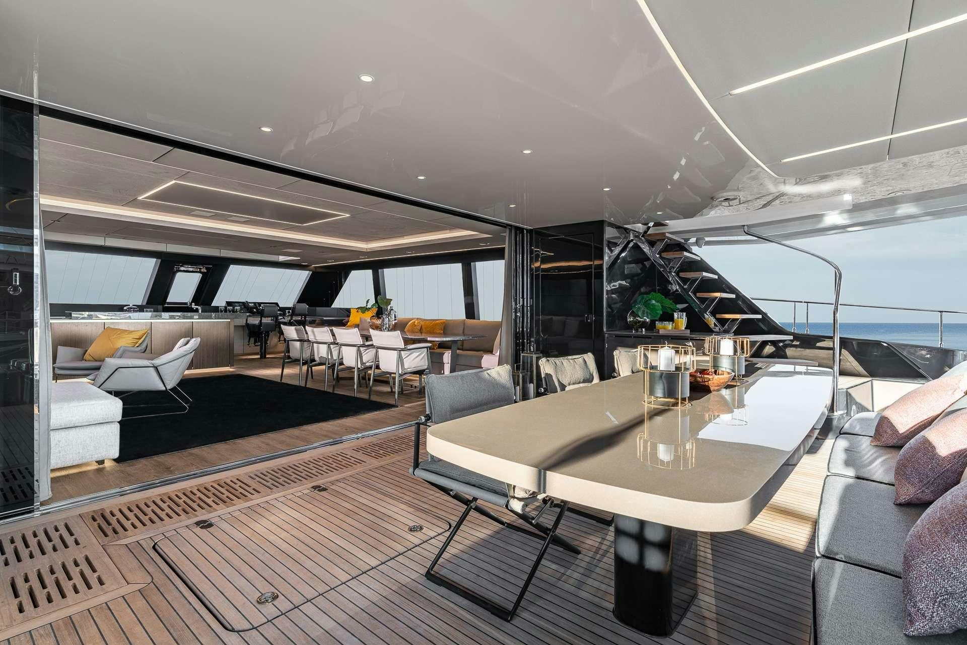 a room with a table and chairs aboard SEIYA Yacht for Charter