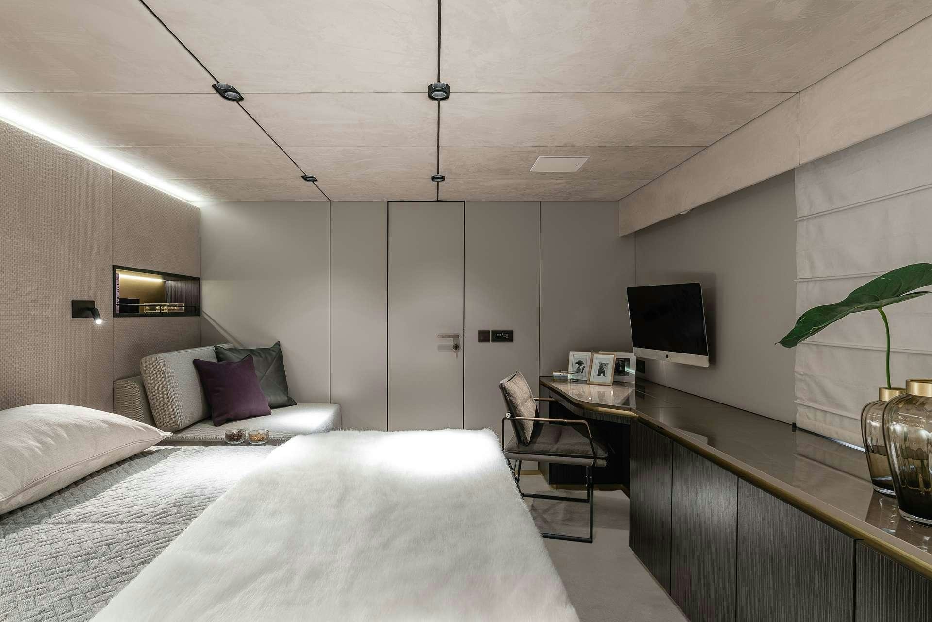 a bedroom with a desk and a bed aboard SEIYA Yacht for Charter