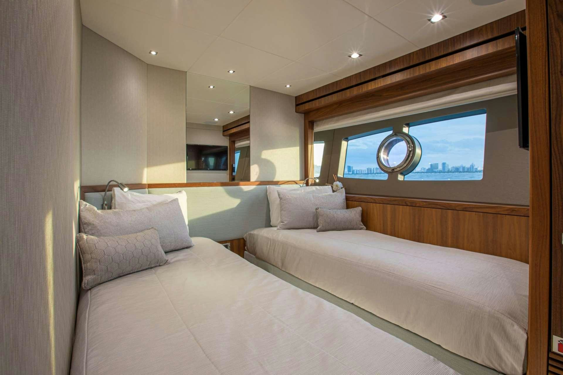 a bed with a white bed aboard PERSEVERANCE 3 Yacht for Charter