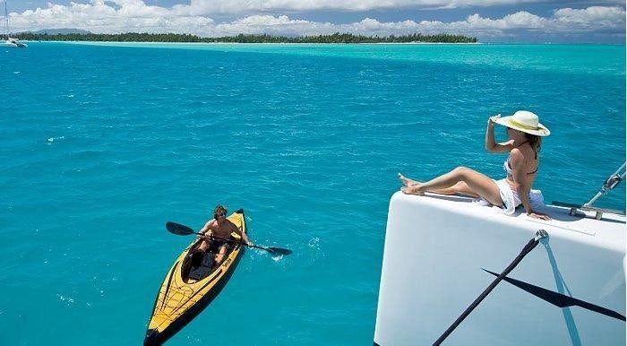 a couple of people in a boat aboard MAGIC CAT Yacht for Charter