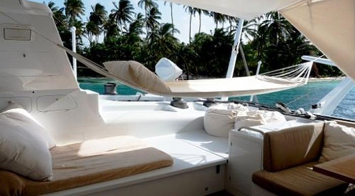 a boat with a person's face on the side aboard MAGIC CAT Yacht for Charter