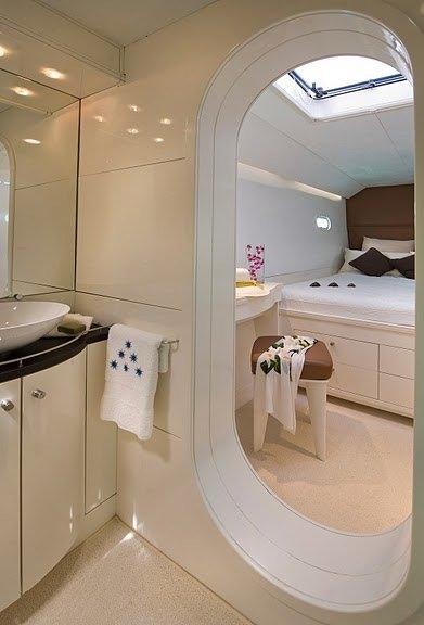 a bathroom with a large mirror aboard MAGIC CAT Yacht for Charter