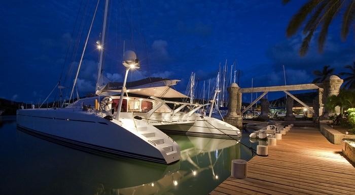 a boat docked at a dock aboard MAGIC CAT Yacht for Charter