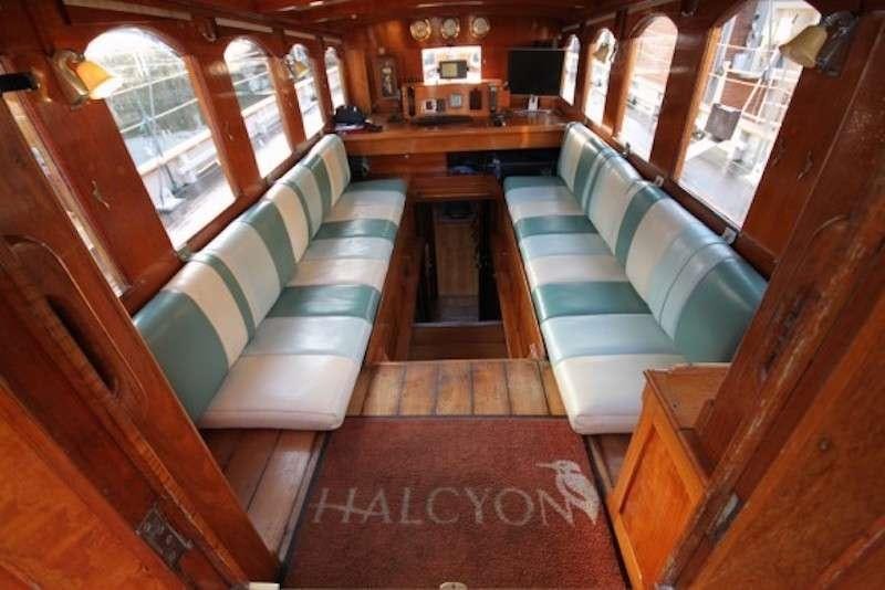 a room with a couch and a table aboard Halcyon Yacht for Charter