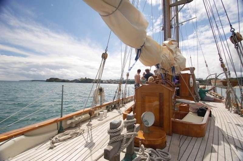 a boat with a group of people on it aboard Halcyon Yacht for Charter