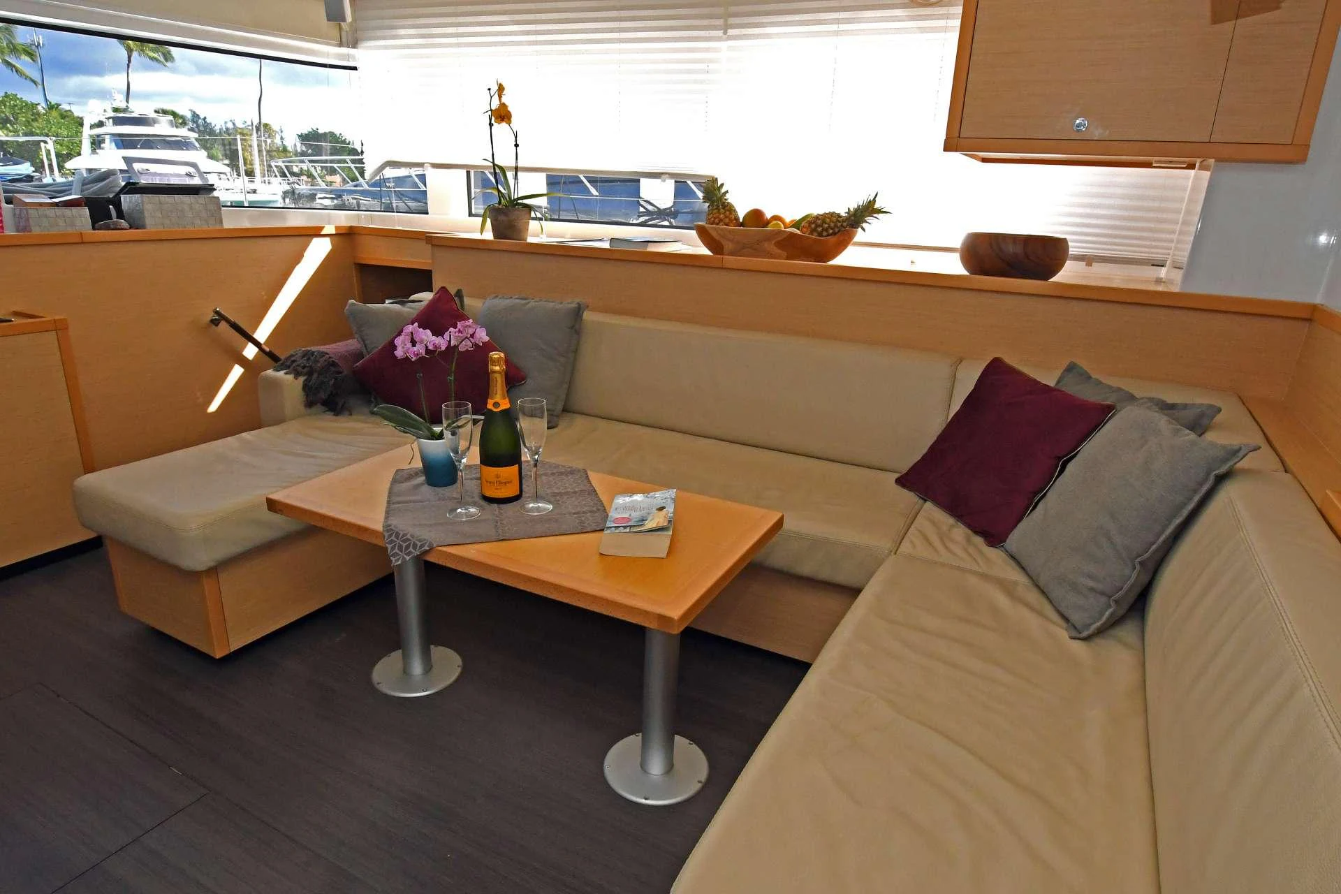 a living room with a couch and a coffee table aboard Samoru ll Yacht for Charter