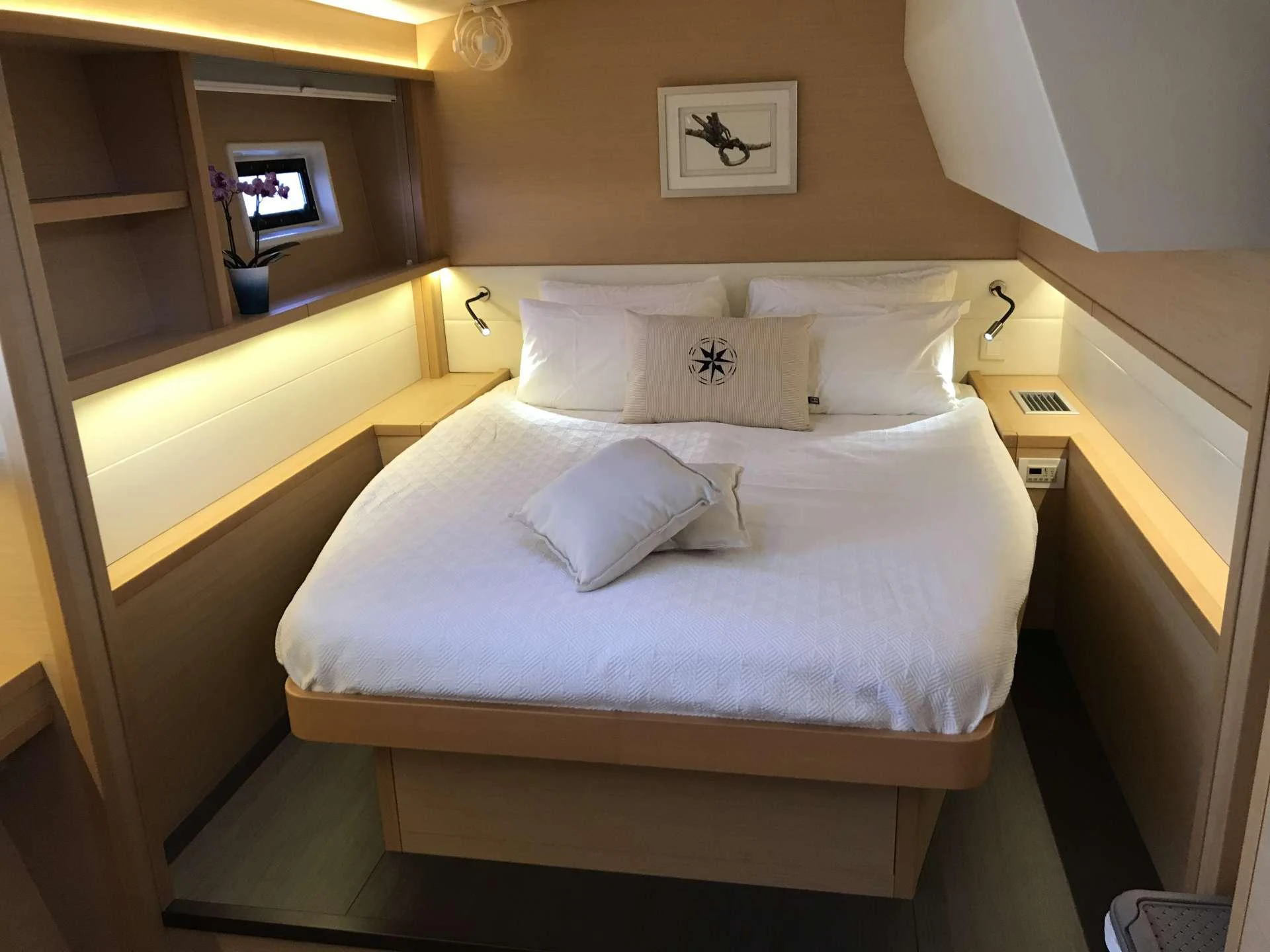 a bed with white sheets aboard Samoru ll Yacht for Charter