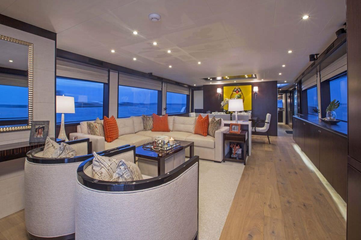 a living room with a large window aboard LADY CARMEN Yacht for Charter