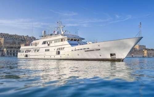 a large white boat in the water aboard SANSSOUCI STAR Yacht for Charter