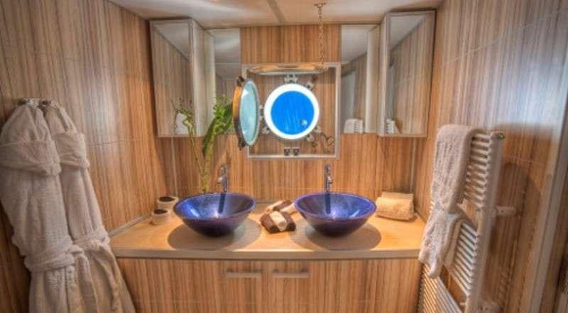 a bathroom with a sink and towels aboard SANSSOUCI STAR Yacht for Charter