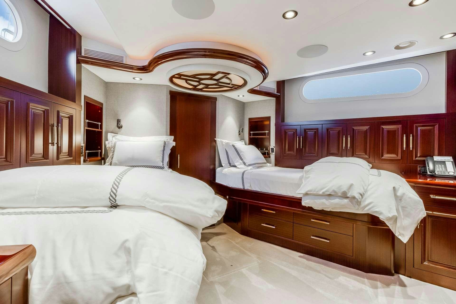 a room with several beds aboard OUR HERITAGE Yacht for Charter